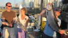 Showing off their fish at shore